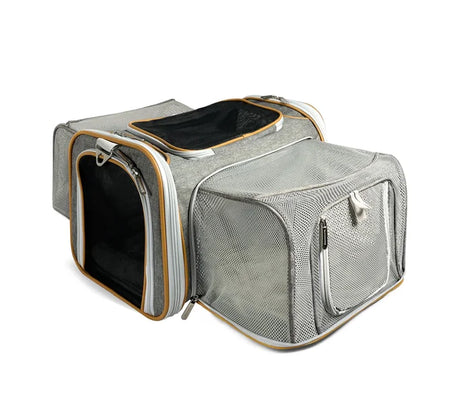 Gray pet carrier with mesh sides on a white background