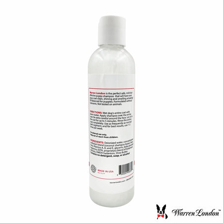 White bottle of Warren London shampoo with label on a white background