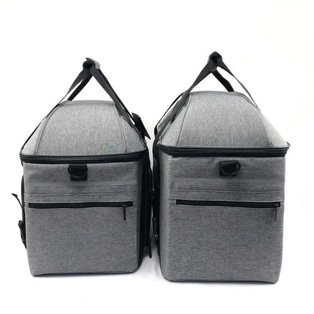 Two gray insulated bags with handles on a white background