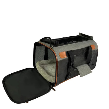 Pet carrier with open lid on a white background