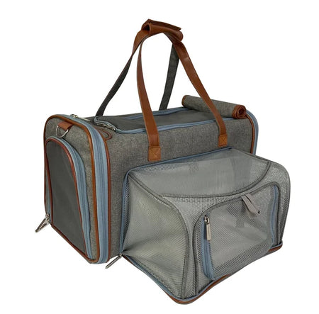 Gray pet carrier with brown straps on a white background