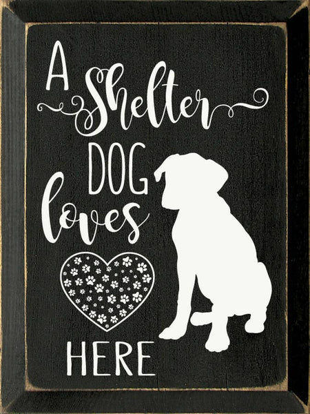 "A Shelter Dog Lives Here" Rustic Wood Home Decor Sign – 9" x 12" – Sawdust City black