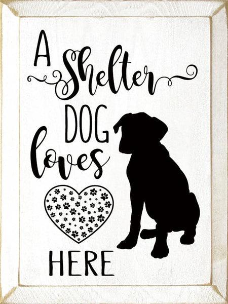 "A Shelter Dog Lives Here" Rustic Wood Home Decor Sign – 9" x 12" – Sawdust City white