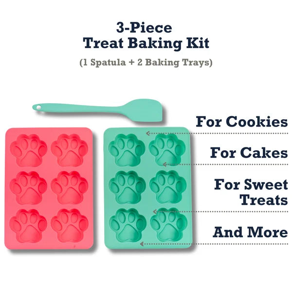 3-piece treat baking kit with pink and green paw print molds and a spatula on a white background.