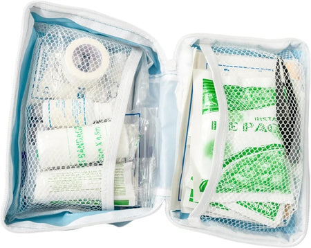 Open first aid kit with bandages and other supplies on a white background
