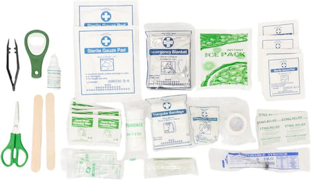 Collection of first aid supplies including bandages, ice pack, and scissors on a white background