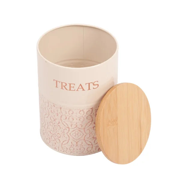 Pink treat jar with a wooden lid on a white background