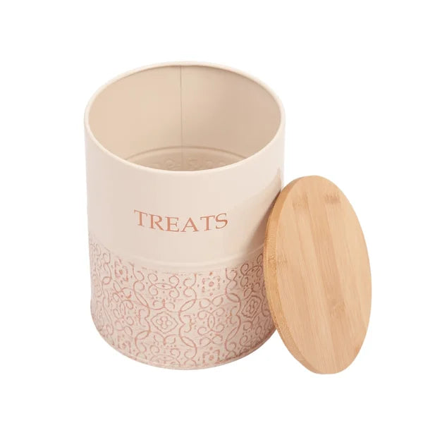 Pink treat jar with wooden lid on a white background