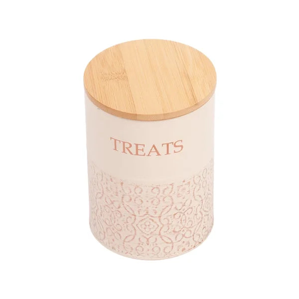 Pink treat jar with a wooden lid on a white background