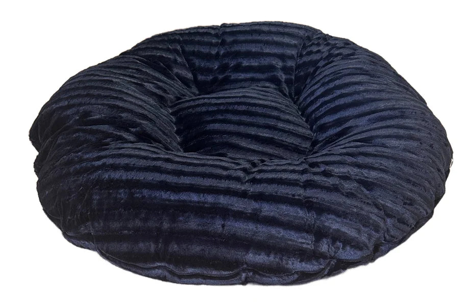 Navy blue donut-shaped pet bed on a white background