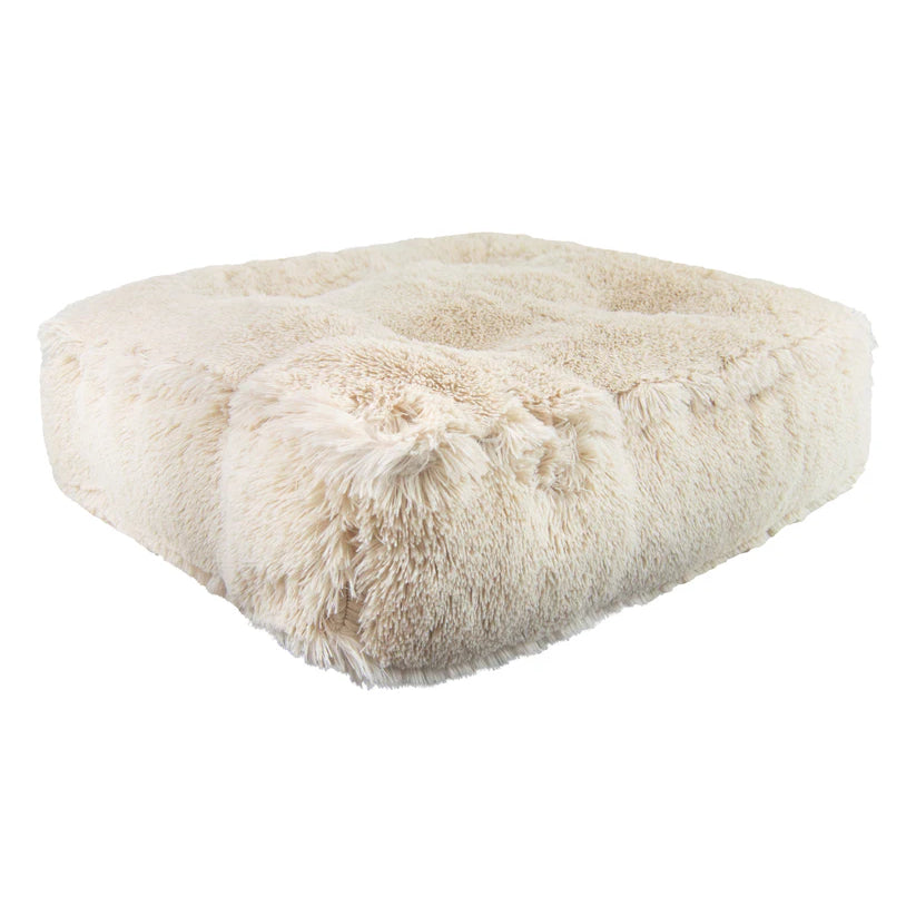 Fluffy white pet bed on a white background