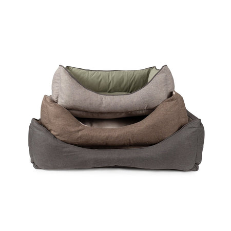Set of three gray pet beds stacked on a white background