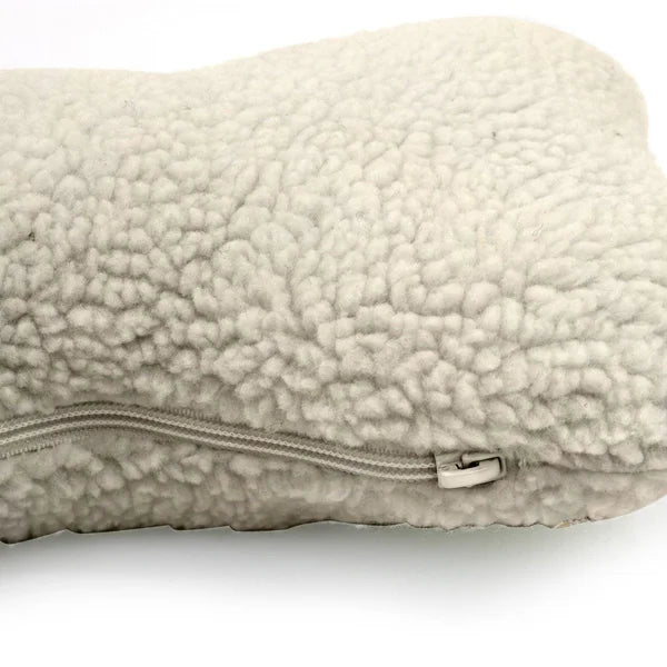 Beige sherpa pillow with a zipper on a white background