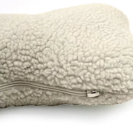 Beige sherpa pillow with a zipper on a white background