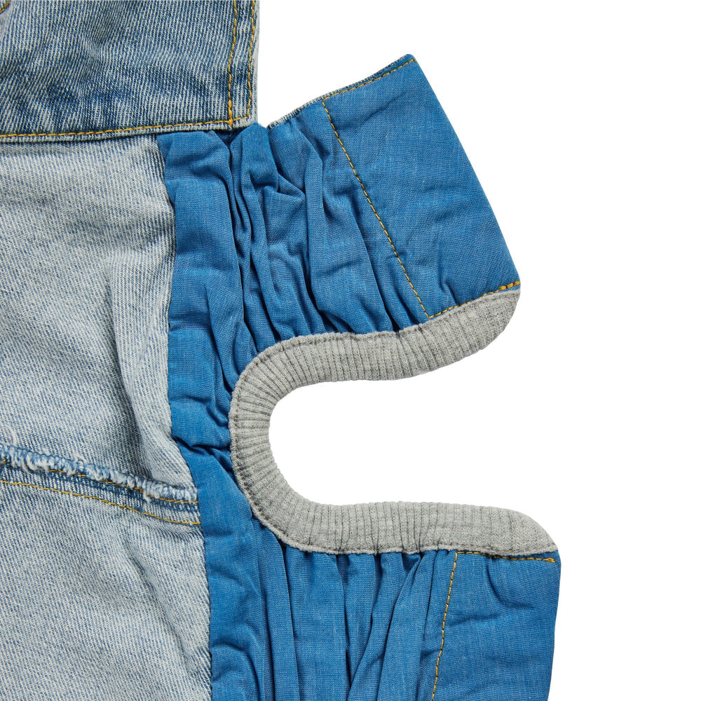 Close-up of denim fabric with a focus on stitching and texture