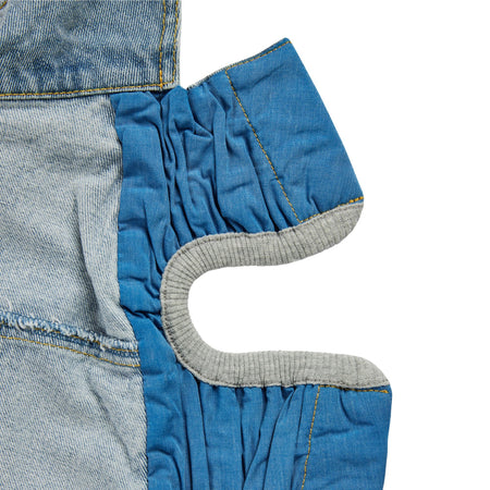 Close-up of denim fabric with a focus on stitching and texture