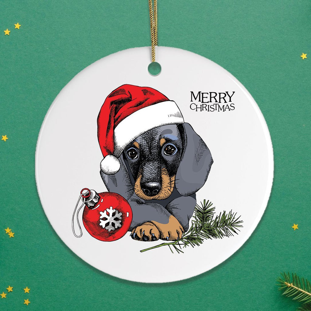 Christmas ornament with a dachshund wearing a Santa hat and holding a red ornament on a green background.