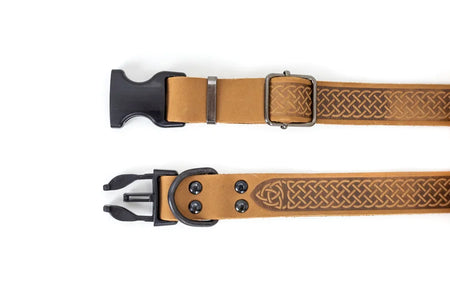 Two brown leather dog collars with Celtic knot designs on a white background