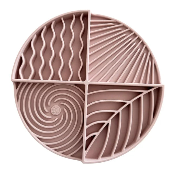 Pink silicone mat with geometric patterns on a white background