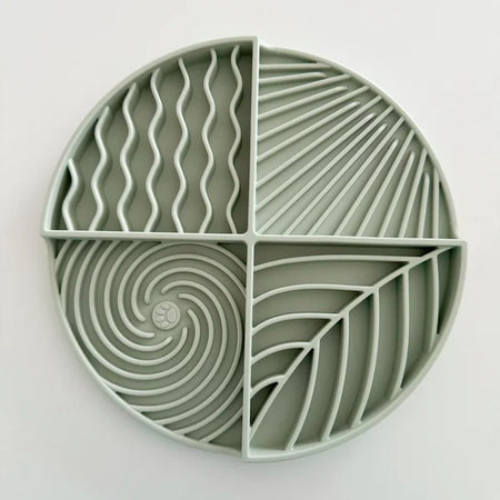 Green silicone mold with geometric patterns on a white background