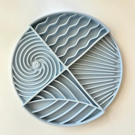 Blue silicone tray with geometric patterns on a beige background