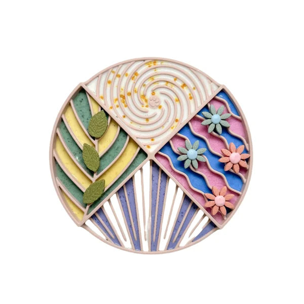 Colorful circular design with geometric patterns and floral elements on a white background