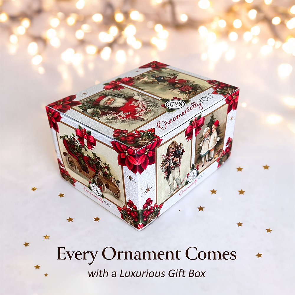Decorative Christmas gift box with festive design on a white background with blurred lights.