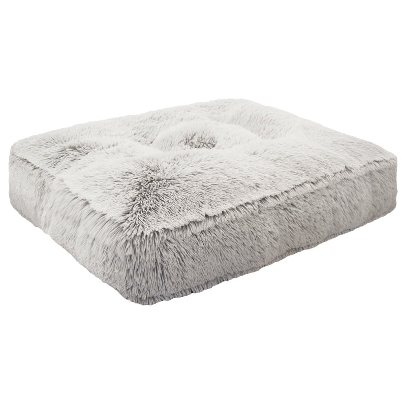 Gray fluffy pet bed on a white background