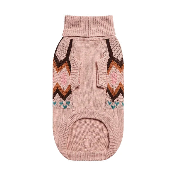 Pink knitted dog sweater with geometric pattern on a white background