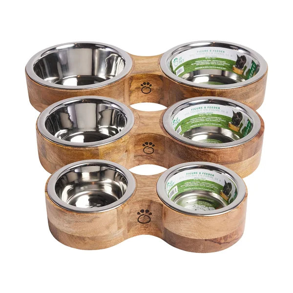 Wooden pet feeder with four stainless steel bowls on a white background