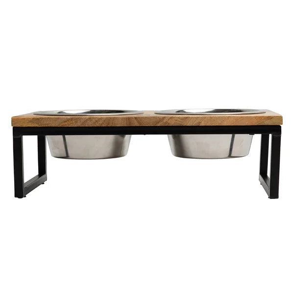 Pet feeding station with wooden top and metal bowls on a white background