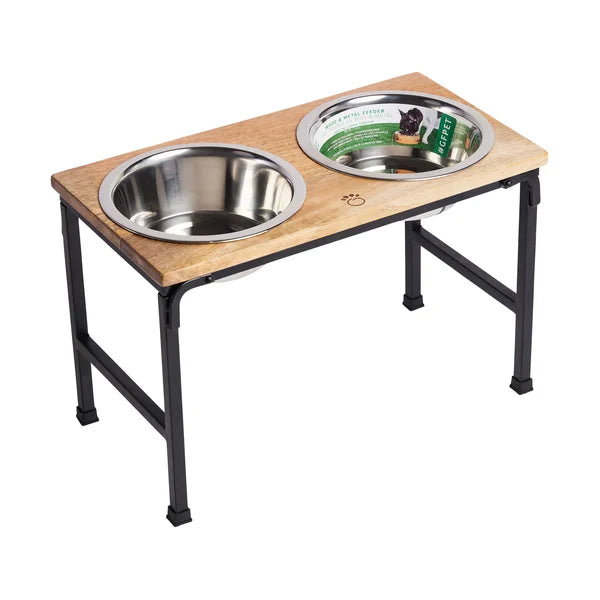 Wooden pet feeding station with two stainless steel bowls on a white background