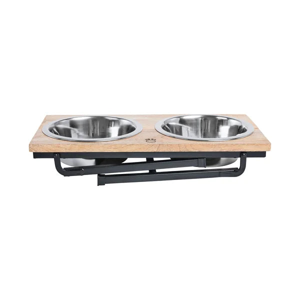 Pet feeding station with two stainless steel bowls on a wooden platform.