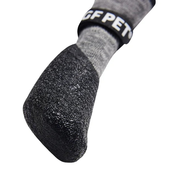 Gray sock with textured sole and 'PET' branding on a white background