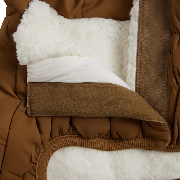 Close-up of a brown quilted jacket with white fleece lining