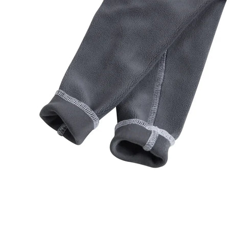 Close-up of gray fleece pants with white stitching on a white background