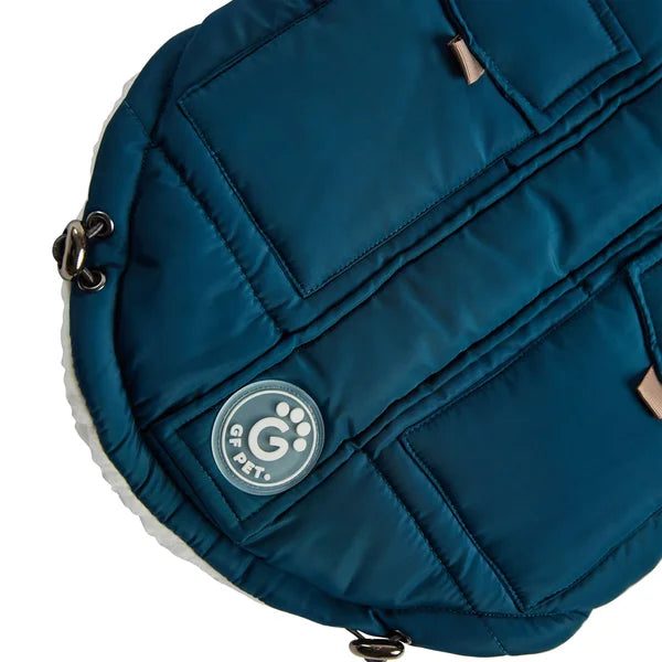 Blue pet carrier with a brand logo on a white background