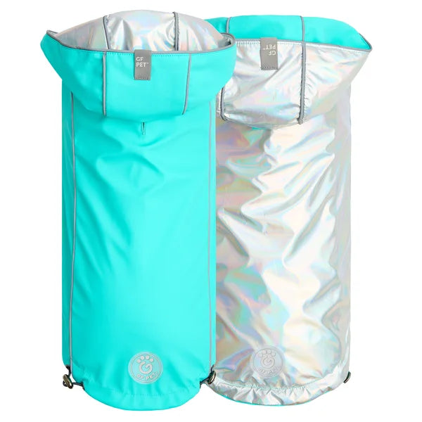 Turquoise and silver pet carrier on a white background