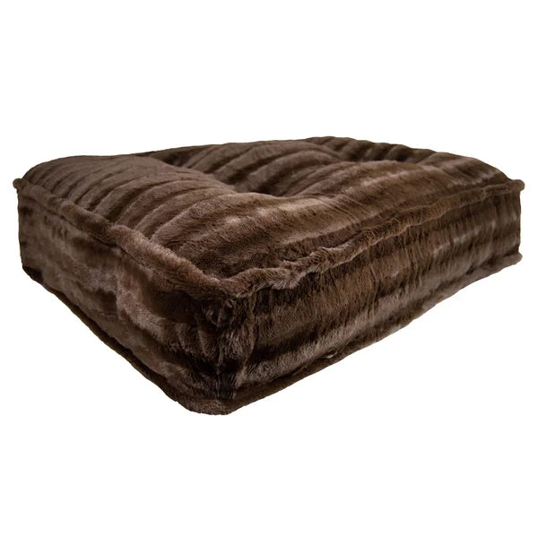 Brown fur-like cushion on a white background