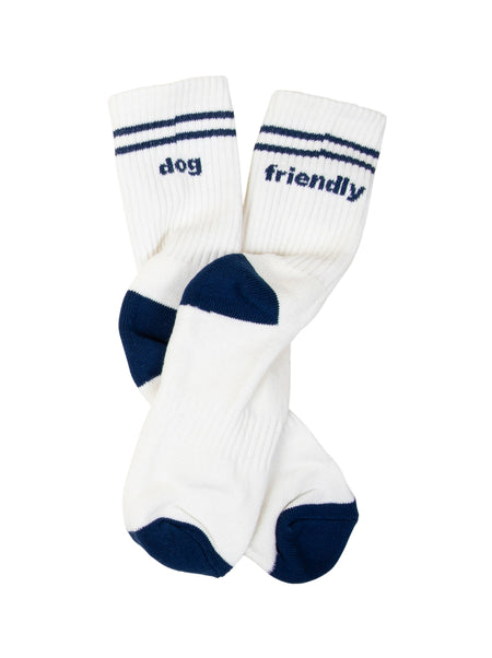 White socks with navy stripes and text on a beige background