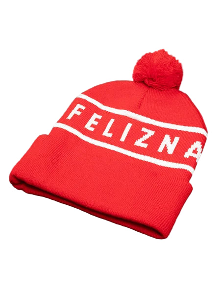 Red beanie with 'FELIZNA' text on a green background