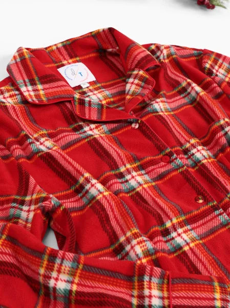 Red plaid shirt with a tag on a white background