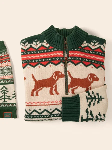 Knitted sweater with dog and Christmas tree patterns on a white background