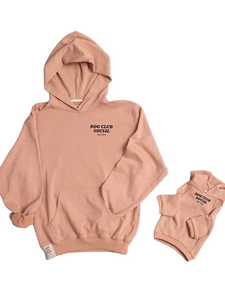 Pink hoodie with text on a light pink background
