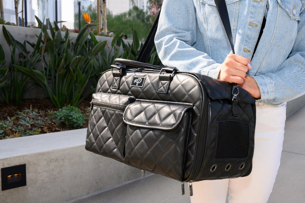 Lux Pet Carrier for Dogs - Petique on shoulder