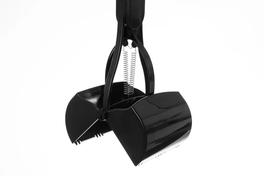 Black snow shovel with spring mechanism on a white background