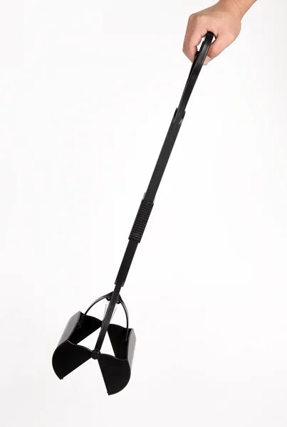 Black snow shovel held by a hand on a white background