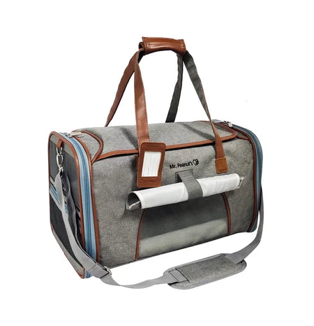 Gray pet carrier with brown straps on a white background