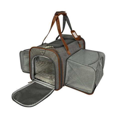 Gray pet carrier with brown straps on a white background
