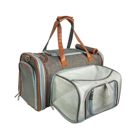 Pet carrier with brown handles and mesh front on a white background